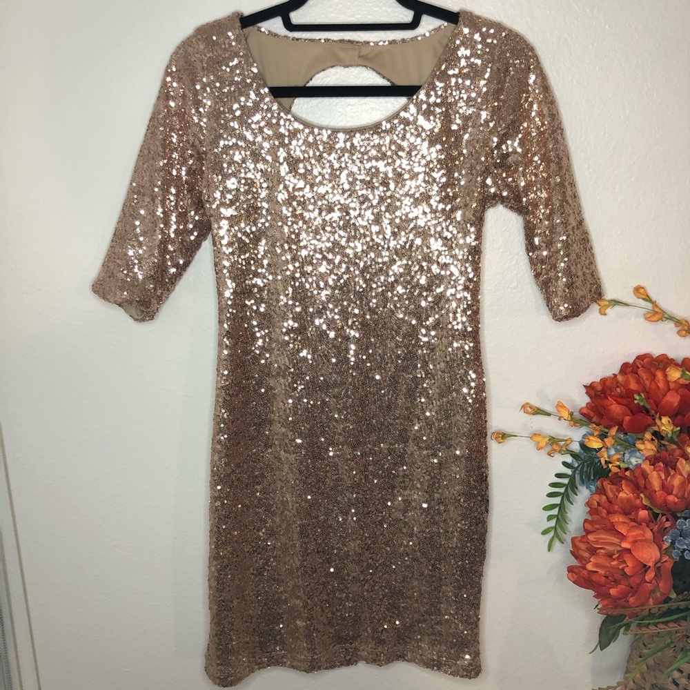 Gold sequin keyhole back quarter length dress.